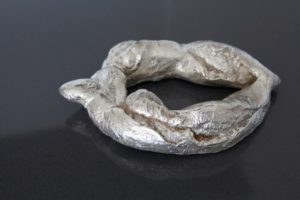 Title- 6 Dinar , cast Bronze Bread sculpture and Silver platted, life size.